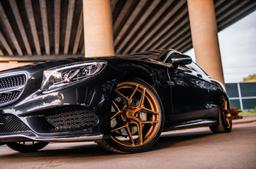 Concaver CVR3 Bronze alloy wheel mounted on car in an atmospheric setting