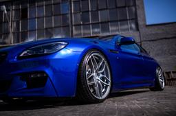 Concaver CVR3 Silver alloy wheel mounted on car in an atmospheric setting