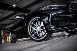 Concaver CVR3 Silver alloy wheel mounted on car in an atmospheric setting