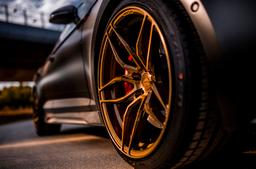 Concaver CVR3 Bronze alloy wheel mounted on car in an atmospheric setting