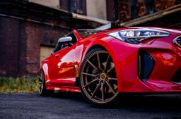 Concaver CVR4 Bronze alloy wheel mounted on car in an atmospheric setting