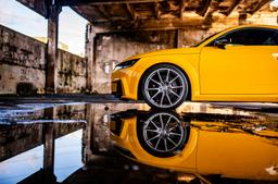 Concaver CVR4 Silver alloy wheel mounted on car in an atmospheric setting