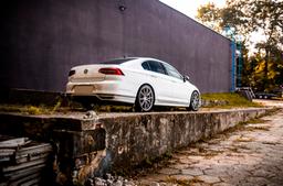 Concaver CVR4 Silver alloy wheel mounted on car in an atmospheric setting