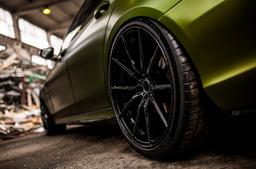 Concaver CVR4 Black alloy wheel mounted on car in an atmospheric setting