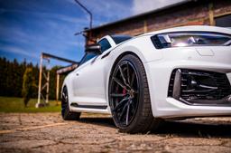 Concaver CVR4 Black alloy wheel mounted on car in an atmospheric setting