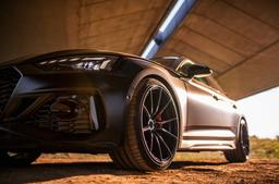 Concaver CVR4 Black alloy wheel mounted on car in an atmospheric setting