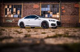Concaver CVR4 Black alloy wheel mounted on car in an atmospheric setting