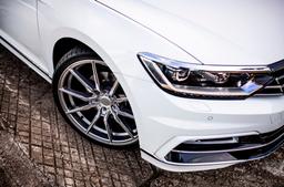 Concaver CVR4 Silver alloy wheel mounted on car in an atmospheric setting