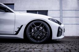 Concaver CVR5 Black alloy wheel mounted on car in an atmospheric setting