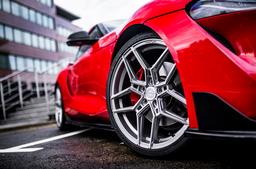 Concaver CVR5 Silver alloy wheel mounted on car in an atmospheric setting