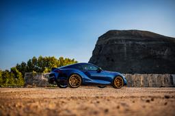 Concaver CVR5 Bronze alloy wheel mounted on car in an atmospheric setting