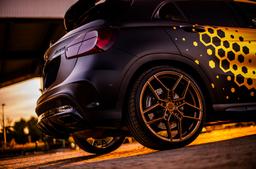 Concaver CVR5 Bronze alloy wheel mounted on car in an atmospheric setting