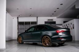 Concaver CVR5 Bronze alloy wheel mounted on car in an atmospheric setting