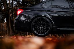 Concaver CVR6 Black alloy wheel mounted on car in an atmospheric setting