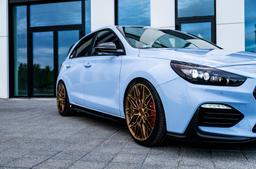 Concaver CVR6 Bronze alloy wheel mounted on car in an atmospheric setting