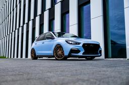 Concaver CVR6 Bronze alloy wheel mounted on car in an atmospheric setting