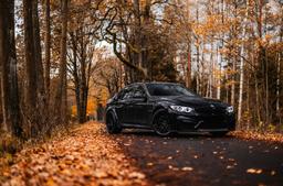 Concaver CVR6 Black alloy wheel mounted on car in an atmospheric setting