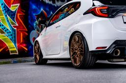 Concaver CVR6 Bronze alloy wheel mounted on car in an atmospheric setting