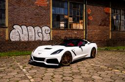 Concaver CVR7 Bronze alloy wheel mounted on car in an atmospheric setting