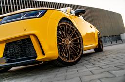 Concaver CVR7 Bronze alloy wheel mounted on car in an atmospheric setting