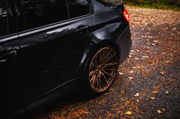 Concaver CVR7 Bronze alloy wheel mounted on car in an atmospheric setting