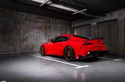 Concaver CVR7 Bronze alloy wheel mounted on car in an atmospheric setting