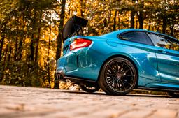 Concaver CVR7 Black alloy wheel mounted on car in an atmospheric setting
