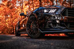 Concaver CVR7 Black alloy wheel mounted on car in an atmospheric setting
