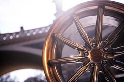 Concaver CVR8 Bronze alloy wheel mounted on car in an atmospheric setting