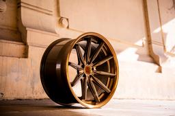 Concaver CVR8 Bronze alloy wheel mounted on car in an atmospheric setting