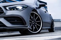 Concaver CVR8 Black alloy wheel mounted on car in an atmospheric setting