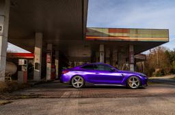 Concaver CVR9 Silver alloy wheel mounted on car in an atmospheric setting