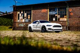 Concaver CVR9 Black alloy wheel mounted on car in an atmospheric setting