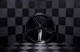 Concaver CVR9 Black alloy wheel mounted on car in an atmospheric setting