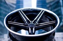 Concaver CVR9 Black alloy wheel mounted on car in an atmospheric setting