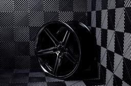 Concaver CVR9 Black alloy wheel mounted on car in an atmospheric setting