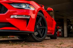Concaver CVR9 Black alloy wheel mounted on car in an atmospheric setting