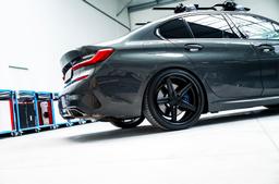 Concaver CVR9 Black alloy wheel mounted on car in an atmospheric setting