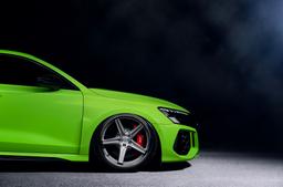 Concaver CVR9 Silver alloy wheel mounted on car in an atmospheric setting