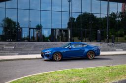 Concaver CVR9 Bronze alloy wheel mounted on car in an atmospheric setting