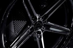 Concaver CVR9 Black alloy wheel mounted on car in an atmospheric setting