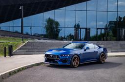 Concaver CVR9 Bronze alloy wheel mounted on car in an atmospheric setting