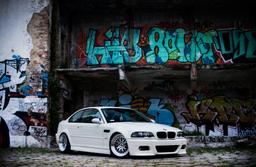 JR Wheels JR10 Silver alloy wheel mounted on car in an atmospheric setting