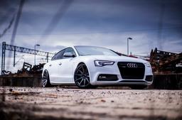 JR Wheels JR11 Grey alloy wheel mounted on car in an atmospheric setting