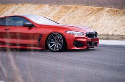 JR Wheels JR11 Grey alloy wheel mounted on car in an atmospheric setting