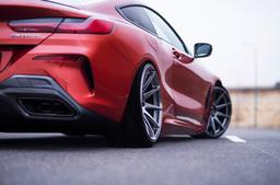 JR Wheels JR11 Grey alloy wheel mounted on car in an atmospheric setting