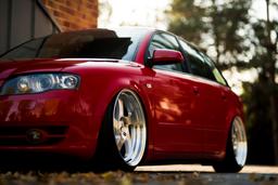 JR Wheels JR15 Silver alloy wheel mounted on car in an atmospheric setting