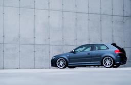 JR Wheels JR18 Silver alloy wheel mounted on car in an atmospheric setting