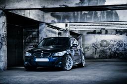 JR Wheels JR18 Silver alloy wheel mounted on car in an atmospheric setting