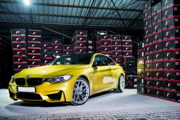 JR Wheels JR18 Silver alloy wheel mounted on car in an atmospheric setting